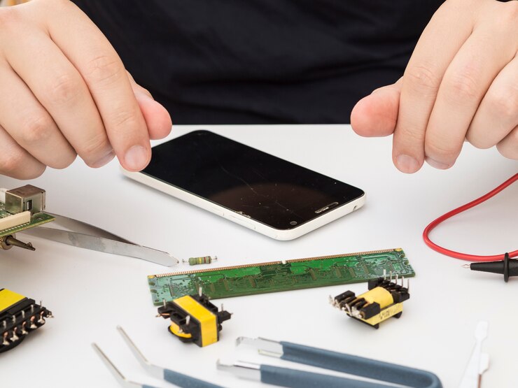 man sitting his work table with electronics 23 2148254089